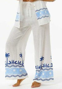 Witte linnen broek met een losse pasvorm, met blauwe palmbomen en zon patronen langs de zoom en een lichtblauwe accent aan de taille.