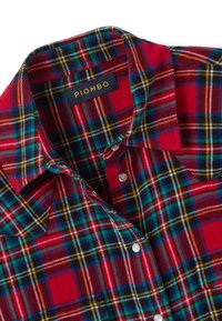 Red plaid shirt featuring a mix of blue, green, yellow, and white check patterns. Soft fabric with a button-down collar and logo tag at the neck.