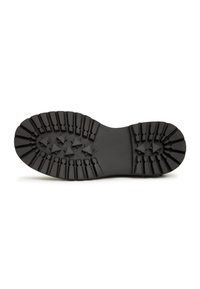 Zwarte rubberen buitenzool met diepe groeven en een gestructureerd oppervlak, met stervormige patronen voor verbeterde grip en stabiliteit.