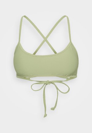 Light green bikini top with a textured ribbed design, adjustable crisscross straps, and a tie closure at the back.