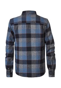 Chemise à carreaux avec des carrés bleus, gris et noirs. Manches longues, col boutonné et détail de poche poitrine unique. Texture de tissu lisse.