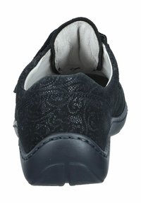 Black suede slip-on shoe with a textured design, padded collar, and a rubber sole. Features a smooth interior lining and stitching details.