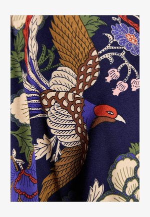 Patterned fabric featuring vibrant colors, with a prominent bird design in brown, blue, and red, set against a dark blue background.