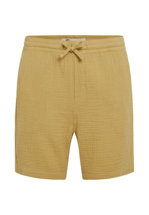 Dzelteni kokvilnas šorti ar elastīgu jostu un auklu, ar fakturētu, krunciņu audumu un sānu kabatām.