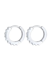 Sølvøreringe i hoops med et struktureret, gear-lignende design. Har små klare sten langs en kant. Markeret som 925 sterling sølv.