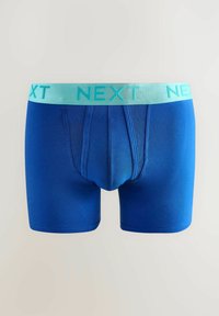 Kék pamut boxeralsó világoskék gumírozott derékkal, amelyen nagybetűkkel a "NEXT" felirat található. Simaság jellemzi, és kényelmesen illeszkedik.
