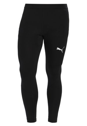 Sorte atletiske leggings lavet af strækbart stof med en glat tekstur. Har et hvidt Puma-logo på venstre lår. Figurtilpasset design.