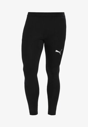 Black athletic leggings made of stretchy fabric with a smooth texture. Features a white Puma logo on the left thigh. Form-fitting design.