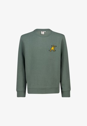 Sweat-shirt vert col rond à manches longues avec un petit motif jaune représentant une figure dansante sur la poitrine gauche.