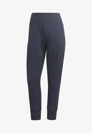 Jogging en molleton marine avec une coupe ajustée, des poignets côtelés, des poches latérales et trois bandes noires sur la cuisse gauche. Fabriqué en tissu doux.