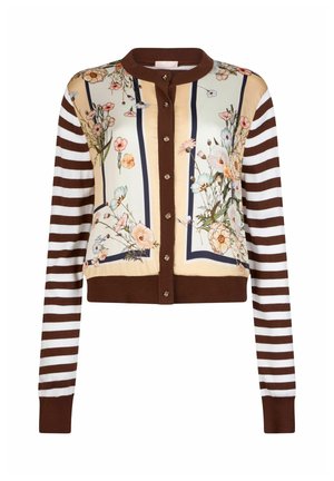 Cardigan court présentant un motif floral sur un fond crème avec des rayures bleu marine. Ourlet côtelé marron et détail de fermeture par boutons.