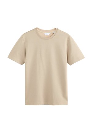 Camiseta de manga corta beige hecha de suave tela de algodón. Presenta un cuello redondo y un corte recto. Sin patrones ni acentos visibles.