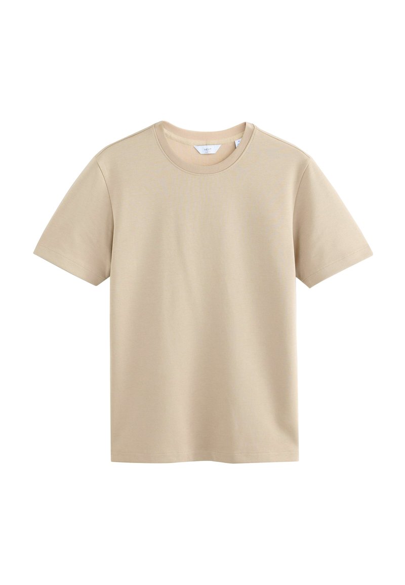 Beige kortærmet t-shirt lavet af blødt bomuldsstof. Har en rund halsudskæring og en lige pasform. Ingen synlige mønstre eller detaljer.