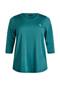 Tyrkysové dlhé rukávy tričko vyrobené z hladkej tkaniny, s okrúhlym výstrihom a malým dekoratívnym akcentom pri ramene.