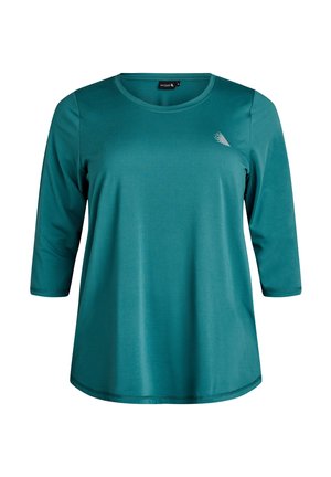 Turkizna dolg rukav majica iz gladkega materiala, z okroglim izrezom in majhnim dekorativnim detajlom blizu rame.