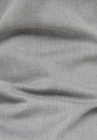 Gray fabric with a smooth texture, displaying subtle fibers and a slight sheen, featuring a plain weave pattern with no distinct accents.