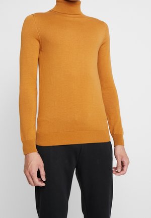 Mosterdgele coltrui van zachte, geribbelde breistof. Getailleerd ontwerp met lange mouwen en afgewerkte boorden. Eenvoudige en naadloze afwerking.