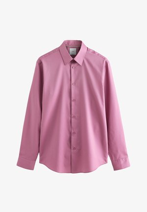 Rózsaszín, hosszú ujjú ing, gombos gallérral, elülső gombolással és sima textúrával. Ívelt alja van.