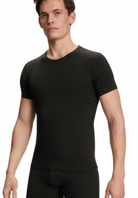 T-shirt nera a maniche corte realizzata in tessuto morbido, con scollatura a girocollo, forma aderente e texture liscia, progettata per comfort e stile.