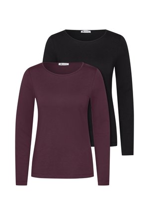 Deux t-shirts unis à manches longues et col rond, un violet foncé à l’avant et un noir partiellement visible derrière.