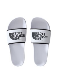 Hvite slidesandaler med svart stropp, med "THE NORTH FACE" i fet skrift. Glatt tekstur og minimalistisk design med kontrasterende detaljer.