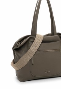 Gray leather handbag with a textured surface, featuring a front zipper pocket and a patterned beige shoulder strap. Accents include a brand logo.