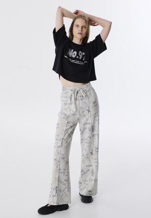 SLOGAN PRINTED - Trainingsbroek - ecru