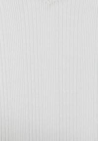 White ribbed fabric featuring vertical stripes and subtle textured patterns. Material appears soft and uniform in color.