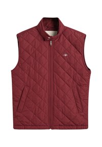 Geklede bordeaux vest met een hoge kraag, een volle ritssluiting aan de voorkant en twee zijzakken. Bevat een klein logo op de borst.