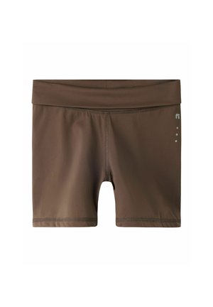 Short marron moulant avec une large ceinture et un petit logo réfléchissant ainsi que des points sur la cuisse droite.