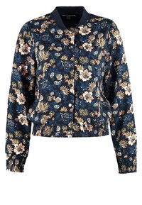 Blommig bomberjacka med marin bakgrund, med elastiska muddar och nederkant, knäppning med knappar och en satinliknande textur.