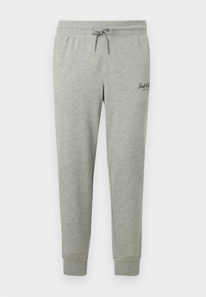 Light gray sweatpants with elastic waistband, drawstring, cuffed ankles, and small black logo on the upper thigh.