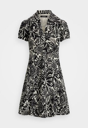 Robe à manches courtes en imprimé floral noir et crème, avec un col et une jupe évasée. Fabriquée en tissu léger.