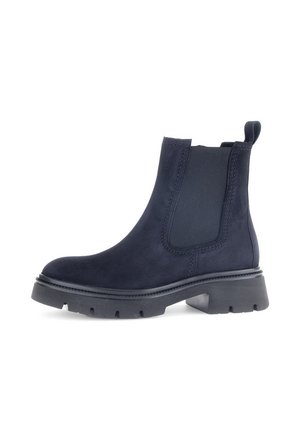 Bottines Chelsea en suède noir avec des panneaux élastiques sur les côtés, bout rond et semelle en caoutchouc épaisse. Dotées d'une languette pour un enfilage facile.