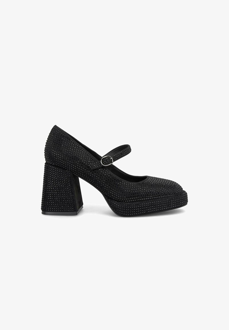 Chaussures Mary Jane noires à talons hauts avec une surface texturée, rehaussées de petits clous, un bout rond et un talon carré épais.