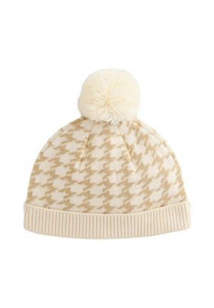 Adīts bēšs cepures beanies ar šaha laukuma rakstu, mīksts pom-poms augšpusē un ribota aproce. Izgatavota no siltas, teksturētas auduma.