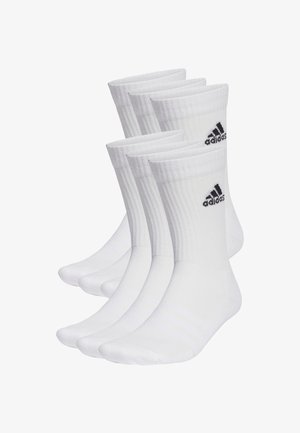 Calze sportive in cotone bianco, confezione da quattro. Presentano una texture a coste, tallone rinforzato e logo Adidas nero nella parte superiore.
