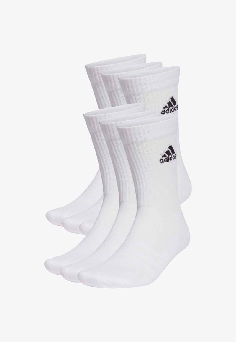 Valged puuvillased spord socksid neljas paketis. Omavad ribakujulist tekstuuri, tugevdatud kontsa ja musta Adidas logo ülaserval.
