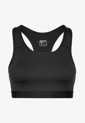 Soutien-gorge de sport noir à dos nageur avec bande élastique sous la poitrine et étiquette de taille et d'entretien imprimée à l'intérieur du dos.