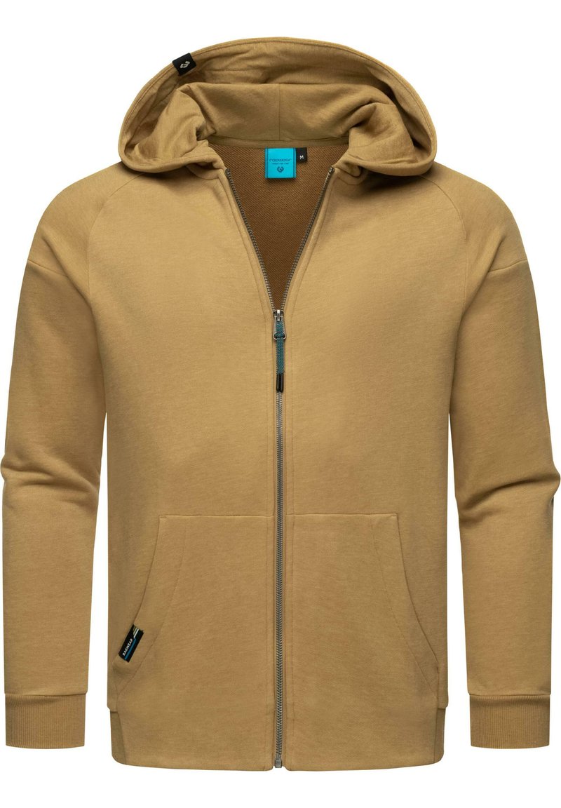 Felpa con zip di colore beige realizzata in materiale morbido, dotata di cappuccio, due tasche frontali e polsini a coste. All'interno presenta una fodera marrone a contrasto.