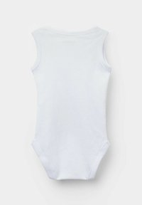 Biała bezrękawnik wykonana z miękkiej bawełny. Posiada okrągły dekolt oraz zatrzaskowe zapięcia u dołu, co ułatwia ubieranie.