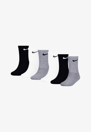 Kuus paari sokke: mustad, valged ja hallid. Puuvilla segu, soonikkoes, keskmise pikkusega, igaüks väike tikitud Nike logo mansetil.