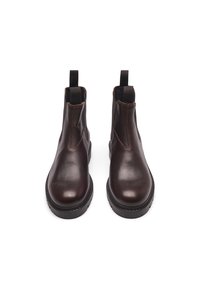 Brown leather ankle boots featuring elastic side panels, round toe, textured finish, contrasting stitching, and a thick rubber sole.