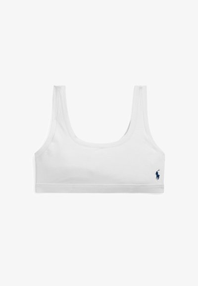 Λευκό αθλητικό σουτιέν με φαρδιούς ιμάντες και μικρό σκούρο μπλε λογότυπο Polo Ralph Lauren στο κάτω δεξιό μέρος.