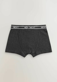 Boxer shorts gris foncé en tissu doux, avec une taille noire ornée du logo "NEXT" en blanc répété. Aucun autre motif visible.