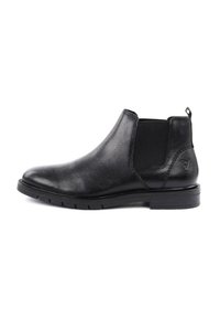Stivaletto Chelsea in pelle nera con pannelli laterali elastici, punta tonda e superficie testurizzata. Tacco basso e linguetta per una facile calzata.