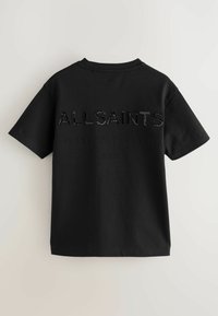 Musta puuvillainen t-paita lyhyillä hihoilla, jossa on kohotettu "ALLSAINTS" -teksti ja lisäteksti japaniksi selässä.