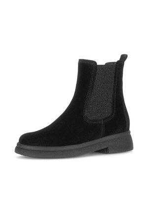 Zwarte enkelboots met suede en stoffen details, elastische zijpanelen, ronde neus, platte rubberen zool en een trekband aan de achterkant.