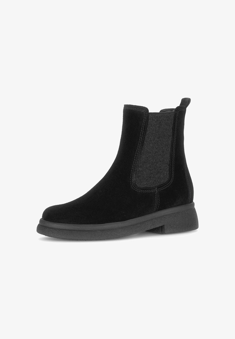 Black ankle boots with suede and fabric detailing, elastic side panels, rounded toe, flat rubber sole, and pull tab at the back.