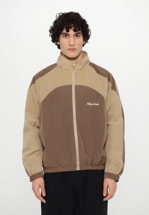 Kidsuper RIPSTOP WINDBREAKER JACKET - Light jacket - brown